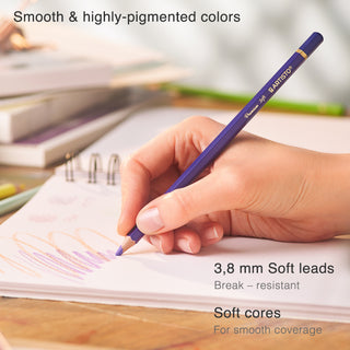 A girl is drawing with a purple pencil in a sketchpad